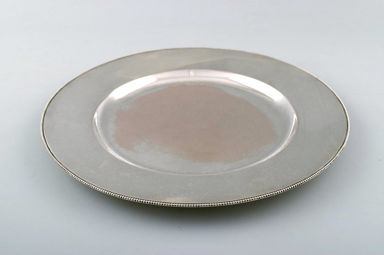 Evald Nielsen coverplate of hammered sterling silver with beaded border.