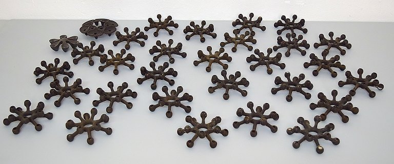 Jens H. Quistgaard, collection of candlesticks in cast iron.
A total of 30 candlesticks.