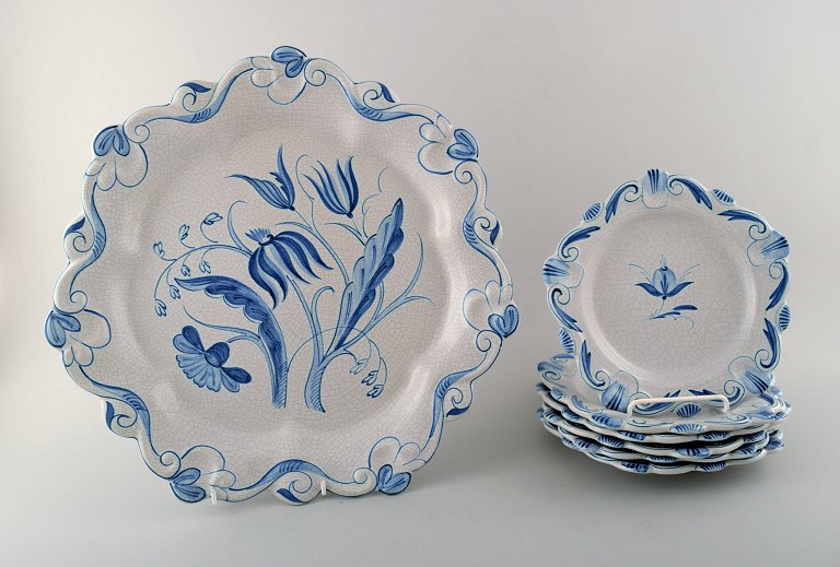 Bo fajans, Sweden, large dish and six plates of hand-painted faience, blue 
glazed.