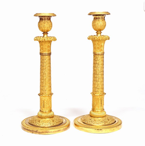 A pair of Louis XVI gilt candle sticks. Paris circa 1800. H: 33cm