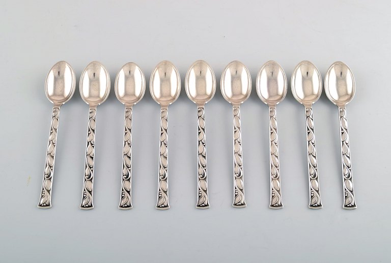 Evald Nielsen no. 30 (leaf pattern), set at 9 tea spoons in sterling silver.