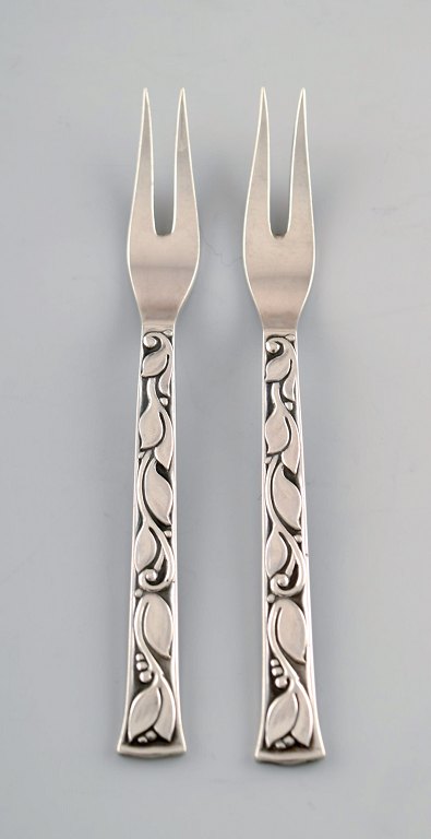 Evald Nielsen No. 30 (leaf pattern), 2 pcs. herring/Cold cut forks in sterling 
silver.