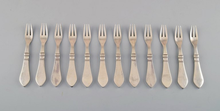 Georg Jensen Continental 12 cake forks, hand hammered.