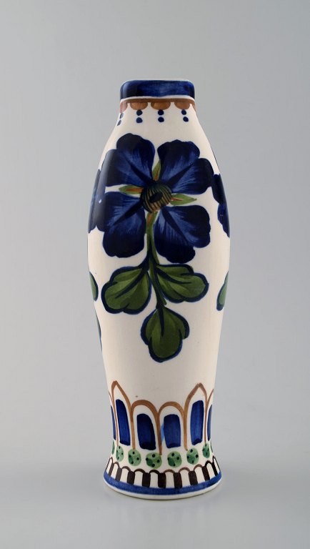 Aluminia faience vase, hand-painted with floral motifs.
