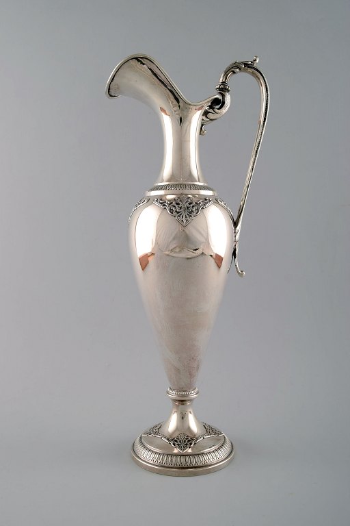 Wine jug of silver, historicism, approx. 1900, stylized foliage, curved handle 
with foliage in relief.