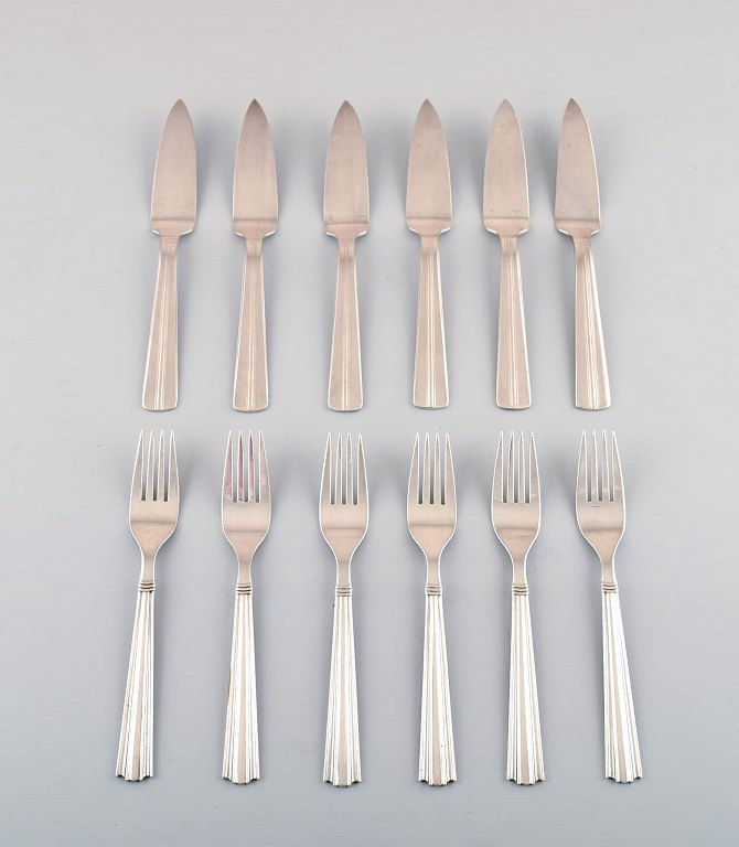 Complete 6 p. Ercuis Art deco fish cutlery in silver plate.
