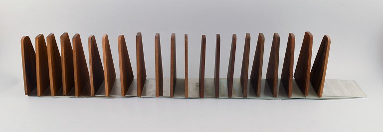 Danish design: 21 stylish bookstands in teak and stainless steel. 1960 s.