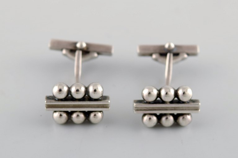 A pair of Georg Jensen art deco cufflinks in sterling silver. 1915-1930. Model 
number 61.
