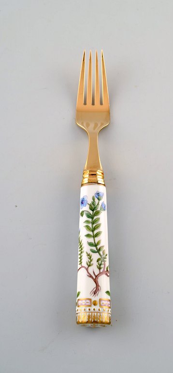 Georg Jensen for Royal Copenhagen. "Flora Danica" dinner fork made of gold 
plated sterling silver. Porcelain handle decorated in colors and gold with 
flowers.