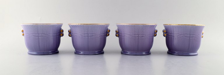 Louise Adelborg (b.1885, 1971) for Rörstrand / Rørstrand, Sweden. Set of four 
Swedish Grace flower pots in purple with gold decoration. 1930 / 40s