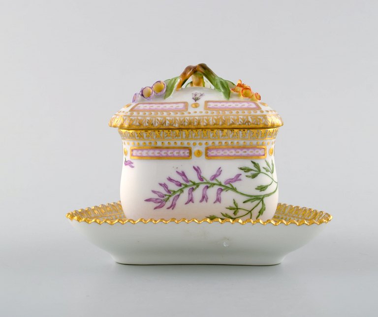 Royal Copenhagen Flora Danica triangular cream cup. Dessin # 20/3575 with branch 
shaped handle and flowers.