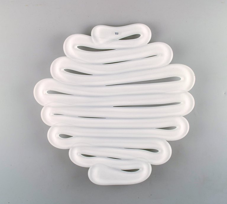 Anna Erhner for Kosta Boda. Large "Energy" dish in white art glass. 21st 
Century.