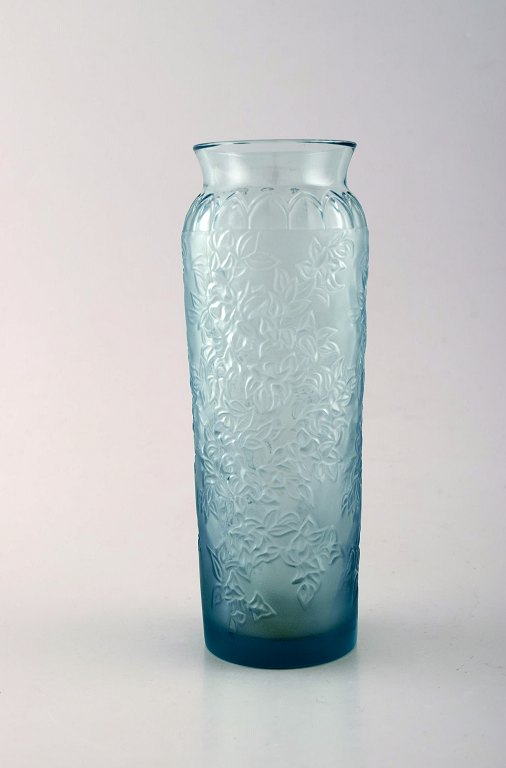 Lalique vase in light blue art glass with floral decoration. 1950