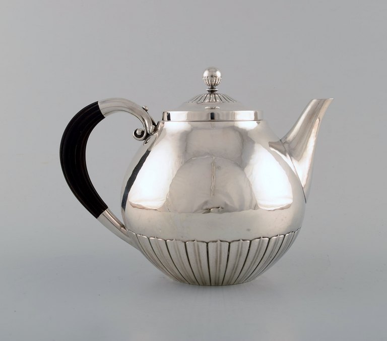 Johan Rohde for Georg Jensen. "Kosmos" teapot in sterling silver with ebony 
handle. Design 45A.