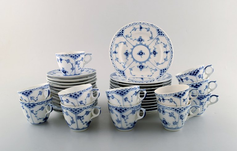 Royal Copenhagen. Blue Fluted Half Lace Coffee Service. Complete for 12 people 
with accompanying plates. Number 1/575.