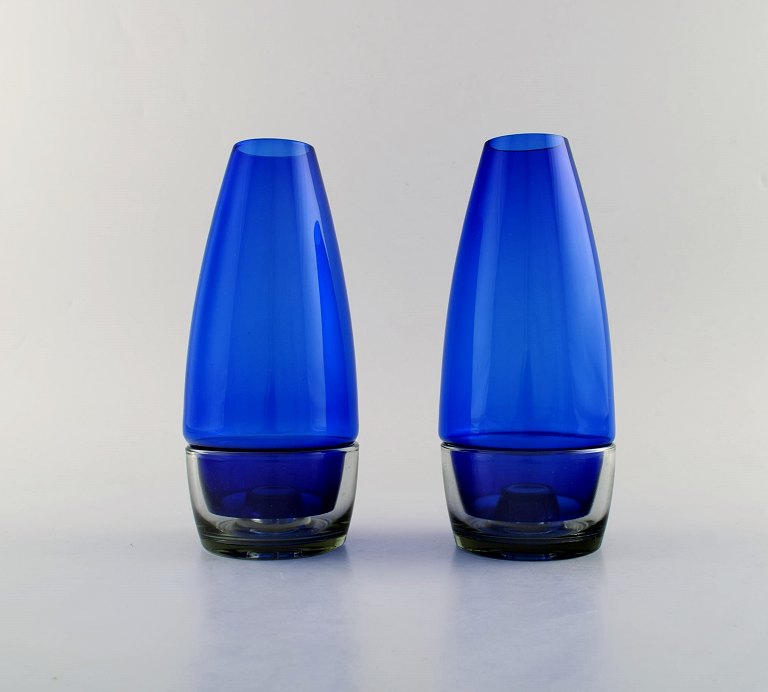 Per Lütken for Holmegaard. A pair of rare "Hygge" lamps for candles in clear and 
blue art glass. Designed in 1958.