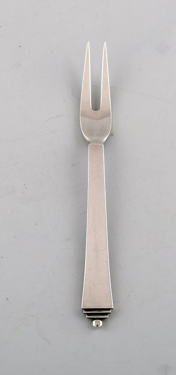 Georg Jensen "Pyramid" cold meat fork in sterling silver. Dated 1933-44. Three 
pieces in stock.