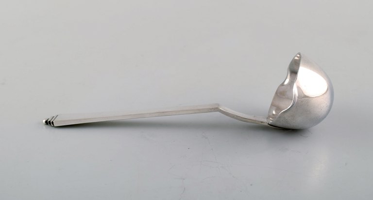 Georg Jensen "Pyramid" sauce spoon in all silver.
