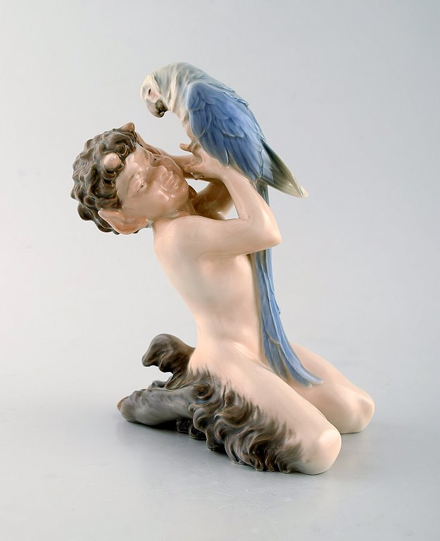 Royal Copenhagen porcelain figurine. Faun with parrot. Model Number: 752.