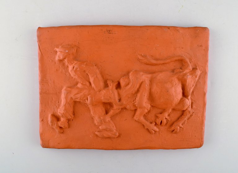 Kloster Ceramic, Ystad. Wall plaque in terracotta. The cow is driven home. 
Swedish design, 1960