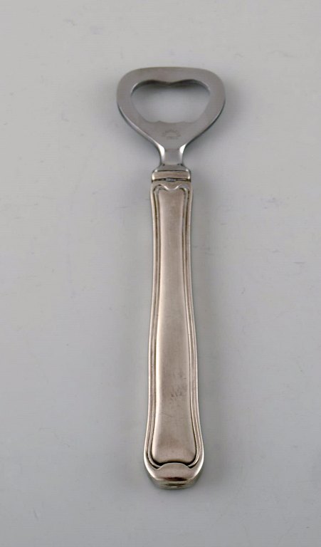 Georg Jensen Old Danish bottle opener in sterling silver and stainless steel. 
