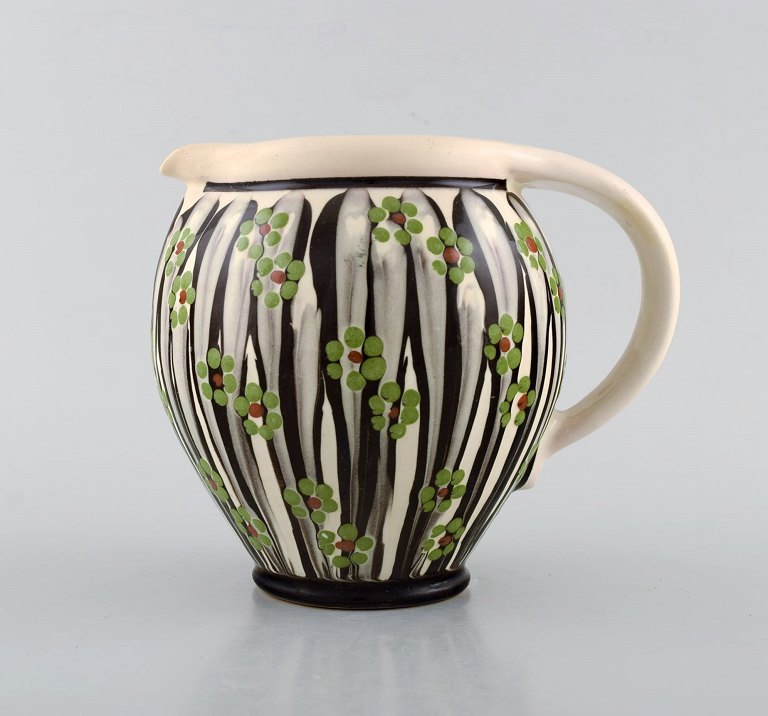 Kähler, HAK, glazed stoneware jug in modern design. 1930 / 40s. Leaves and 
branches on cream colored background.
