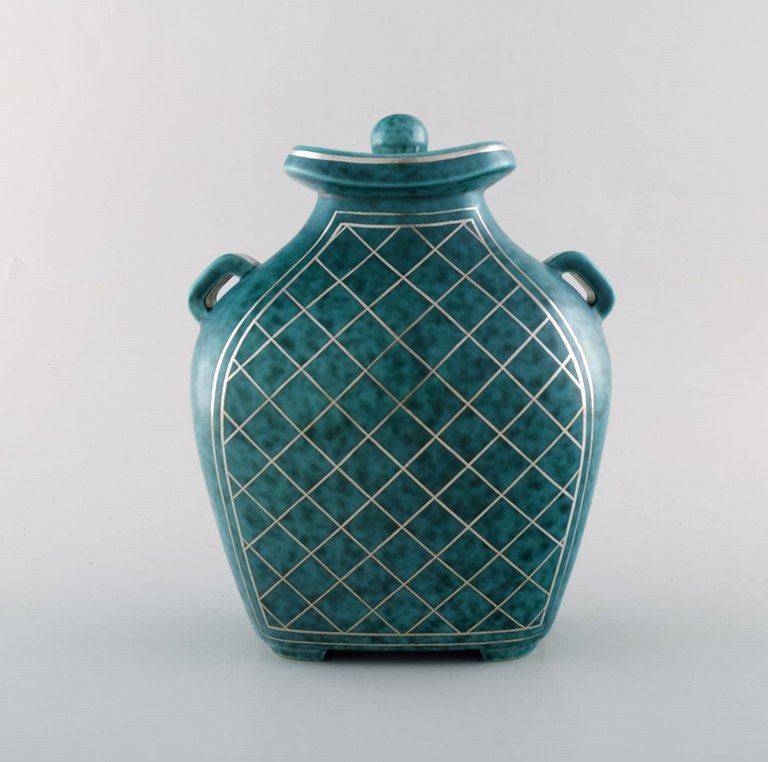 Wilhelm Kåge for Gustavsberg. Argenta lidded vase in ceramic decorated with 
checkers in silver inlaid. Sweden, 1940