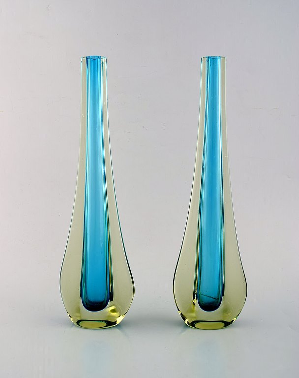 A pair of Murano vases in light blue and smoke colored, mouth blown art glass. 
1960