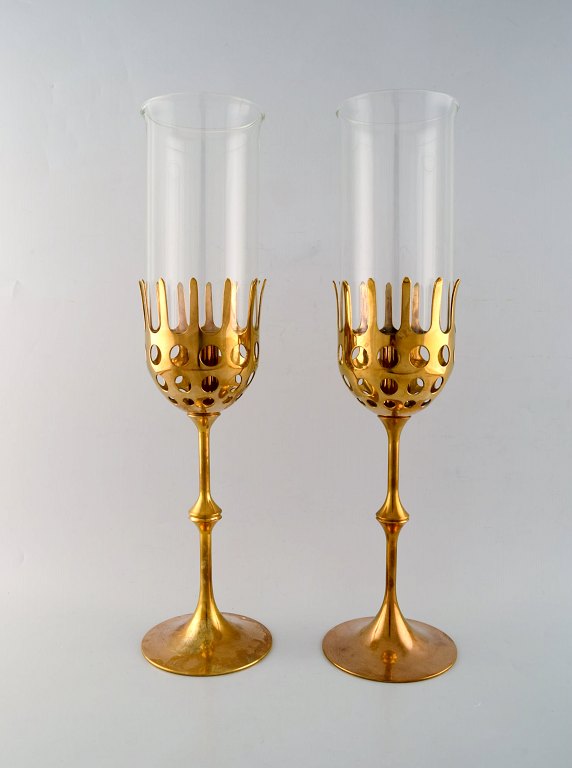 Bjørn Wiinblad (1918-2006). Two "Hurricane" candle holders in brass with blue 
tinted glass. 1970