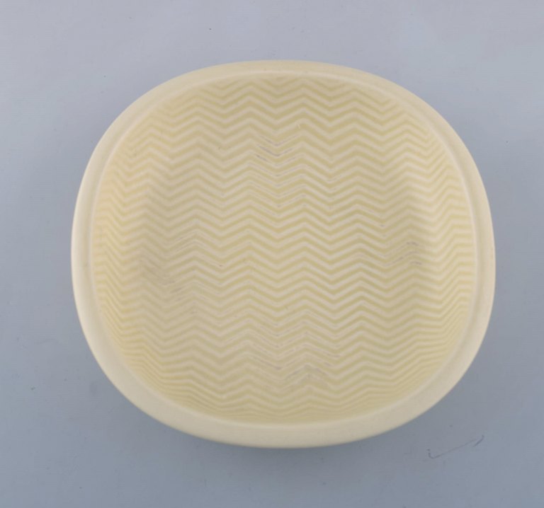Nils Thorsson for Aluminia. "Marselis" faience bowl with geometric pattern in 
beautiful eggshell glaze. Mid 20th century.
