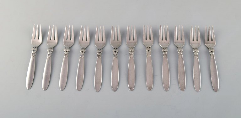Twelve Georg Jensen "Cactus" pastry forks in sterling silver.
