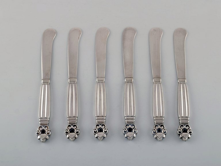 Six Georg Jensen "Acorn" butter knives in all sterling silver.
