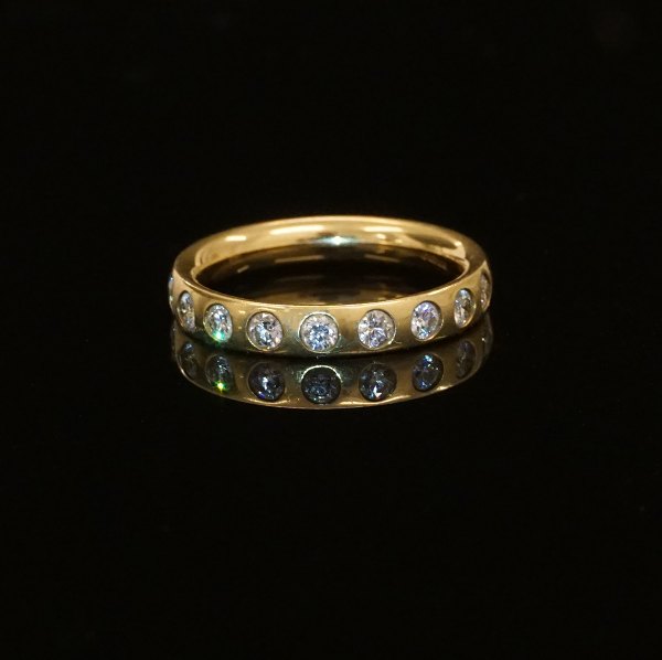 Georg Jensen: An 18kt gold ring with nine diamonds. Ringsize 55