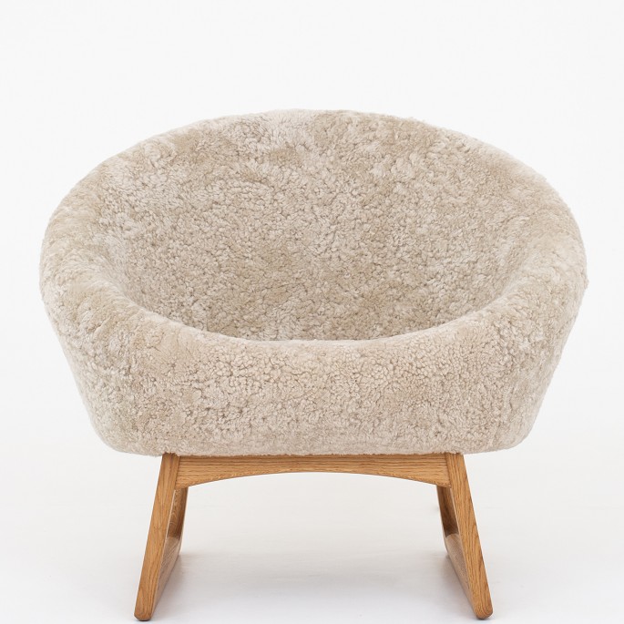 Kurt Østervig / Klassik Studio
Model 57A - Tub chair upholstered in Moonlight color 09 w. sledbase in oiled 
oak.
Availability: 6-8 weeks
Original condition
