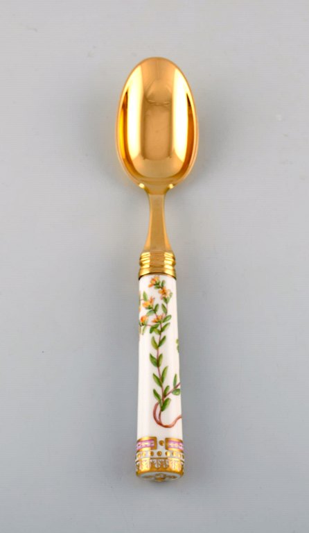 Michelsen for Royal Copenhagen. "Flora Danica" dinner spoon made of gold plated 
sterling silver. Porcelain handle decorated in colors and gold with flowers.
