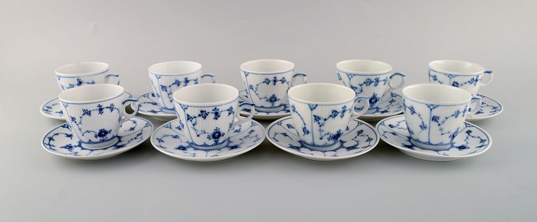 Royal Copenhagen. Set of nine Blue Fluted plain coffee cup with saucer # 1/80.
