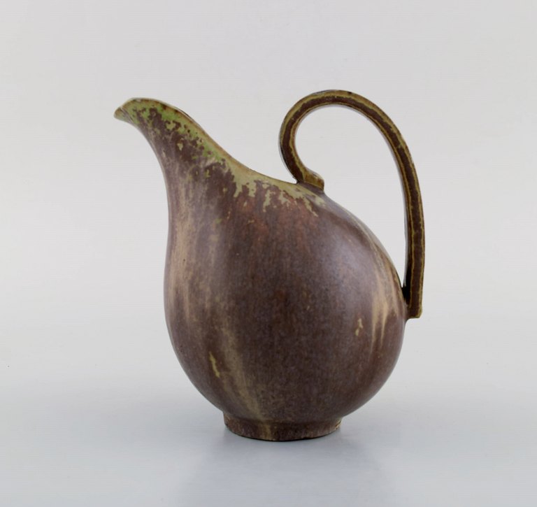 Arne Bang. Jug with handle in glazed ceramics. Model number 161. Beautiful glaze 
in green and brown shades. 1940/50