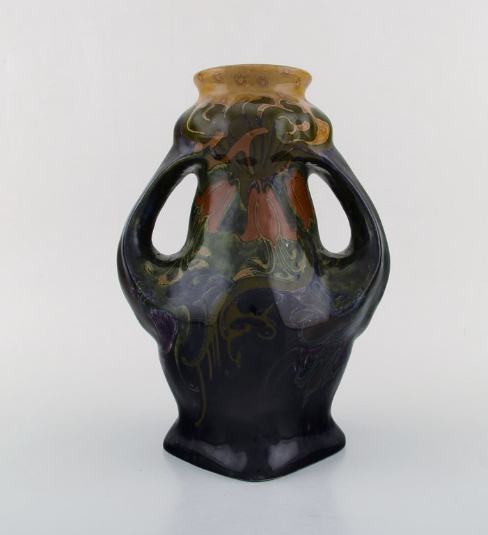 Rozenburg, Den Haag. Large art nouveau vase with gloves in glazed ceramics with 
flowers. 1910 / 20