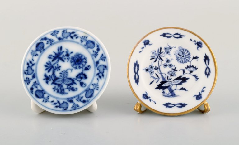 Two Meissen advertising plate holders in hand-painted porcelain. Early 20th 
century.
