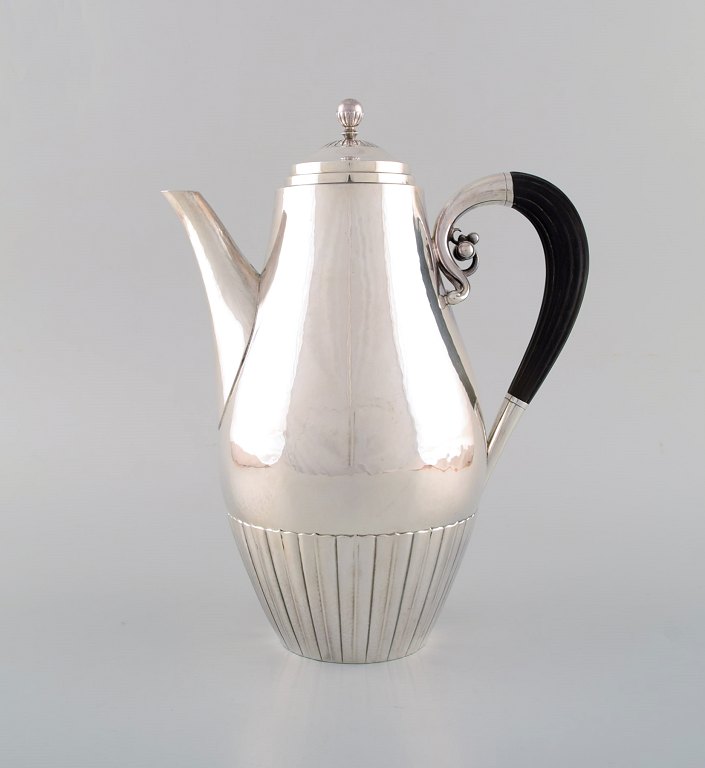 Johan Rohde for Georg Jensen. Cosmos coffee pot in sterling silver with ebony 
handle. Design 45A.
