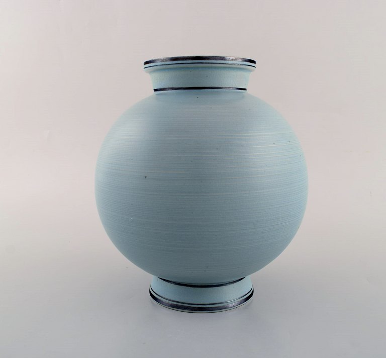 Wilhelm Kåge for Gustavsberg. Rare art deco ceramic vase decorated with silver 
inlay. Beautiful turquoise glaze. Sweden, mid-20th century.
