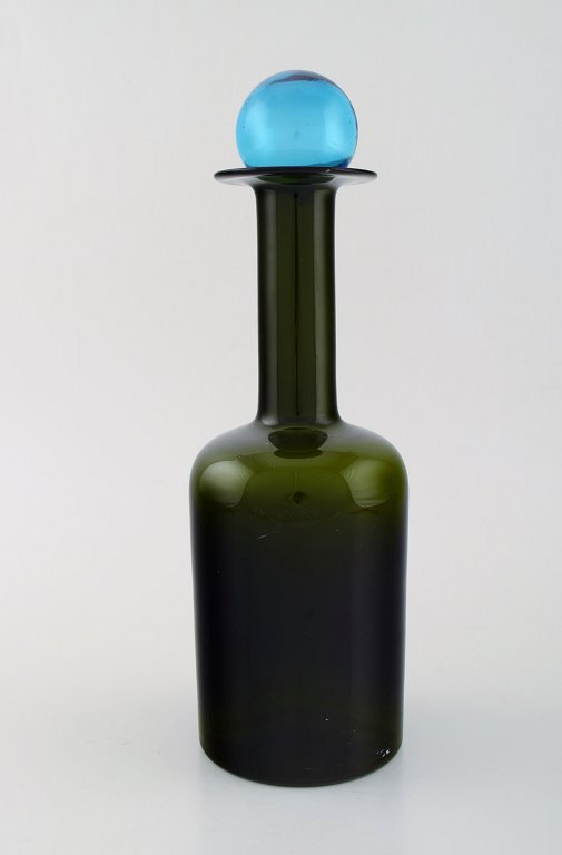 Otto Brauer for Holmegaard. Large vase / bottle in green art glass with blue 
ball. 1960