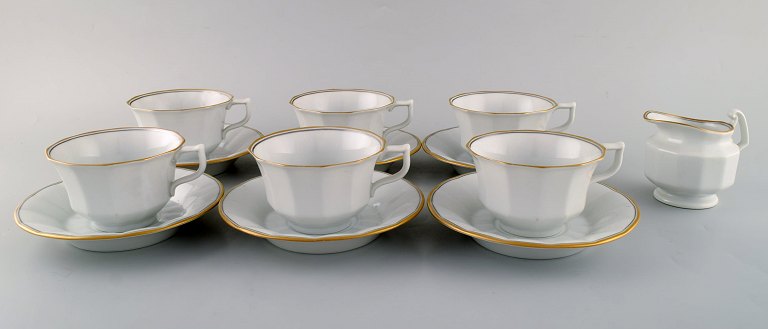 Royal Copenhagen Palace coffee service for six people in porcelain with gold 
decoration. 1980