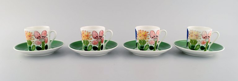 Stig Lindberg for Gustavsberg. Four rare Tahiti coffee cups with porcelain 
saucers with floral motifs. 1960
