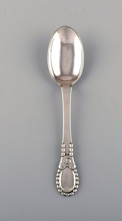 Evald Nielsen number 13 large tablespoon in hammered silver (830). Dated 1924.
