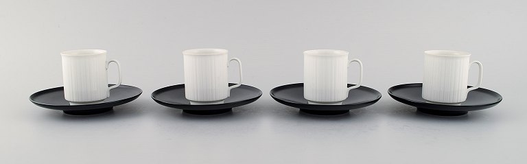 Tapio Wirkkala for Rosenthal. Four porcelain noire mocha cups with saucers in 
black and white fluted porcelain. Designed in 1962.
