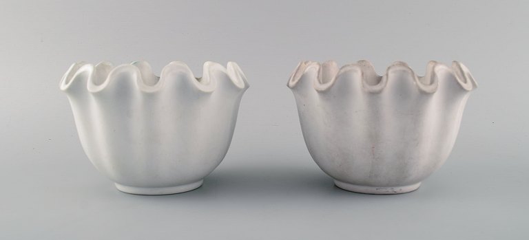 Wilhelm Kåge for Gustavsberg. Two Carrara ceramic vases / bowls with wavy edge.
