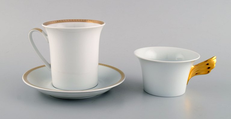 Gianni Versace for Rosenthal. Two cups in white porcelain with gold decoration. 
Late 20th century.
