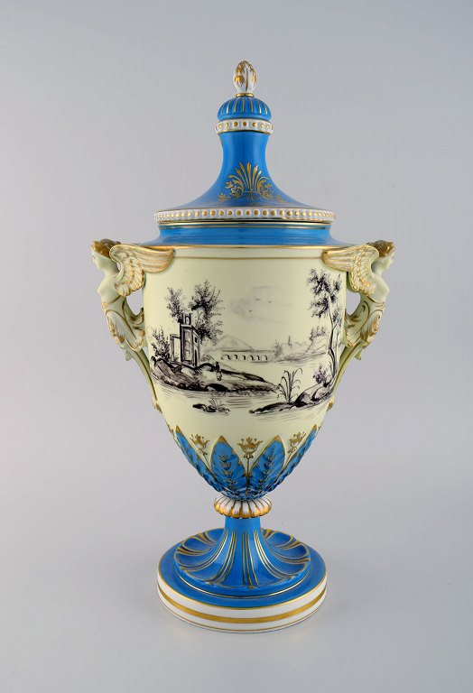 Large Dresden ornamental vase in hand-painted porcelain with classicist scenes 
and handles in the shape of angels. 19th century.
