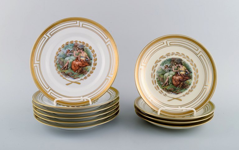 Royal Copenhagen. Ten plates decorated with flowers and romantic scenery. Gold 
decoration. 1960s / 70s.
